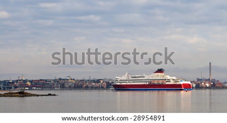 Passenger ferry ship arrives to Helsinki harbour atsunny early morning