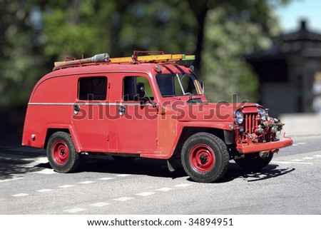 Retro Fire engine on a road against a blur background