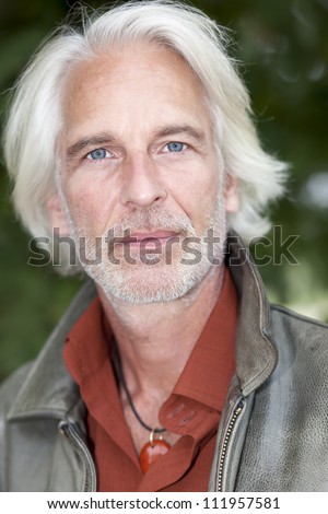 An image of a handsome male portrait with white beard