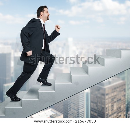 An image of a handsome business man moving upwards