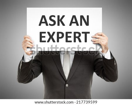 A business man holding a paper in front of his face with the text ask an  expert