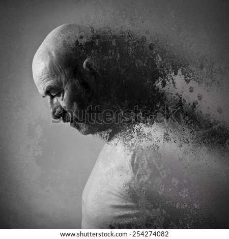 An old man with a grey beard in sorrow