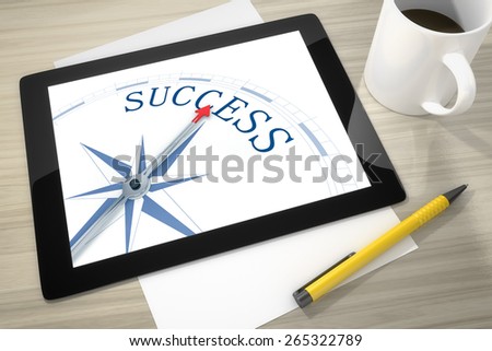 An image of a tablet pc with a compass success