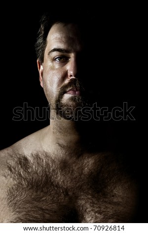 stock photo An image of a hairy man in a dark style