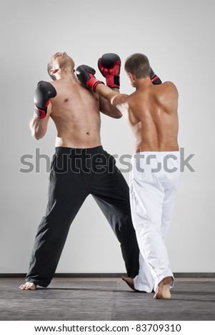 An image of two men box fighting