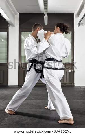 An image of a women and a man fighting