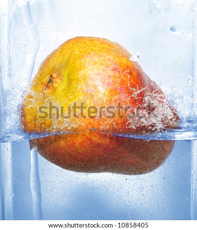 splashing pear into a water