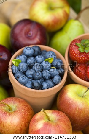 summer or autumn fresh fruit including: blueberries, strawberries, apples and pears