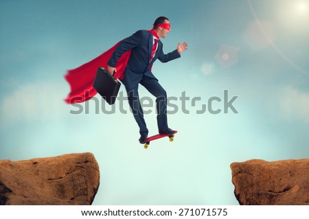 superhero businessman making a risky leap of faith on a skateboard