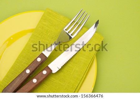 Table setting with fork, knife and plates