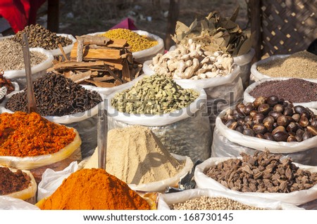 Various of Indian colored powder spices on the flea market in India, Goa.