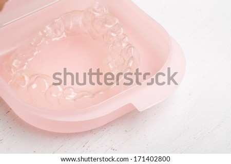 Individual tooth tray for whitening in pink plastic box