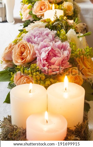 Event party or wedding decoration with candles and flowers on the table
