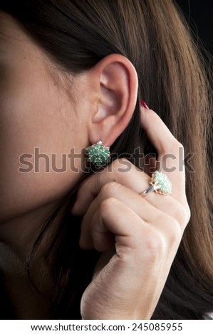 Silver collection of ring and earrings with emerald
