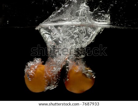Splashing persimmons.Series of splashing fruits