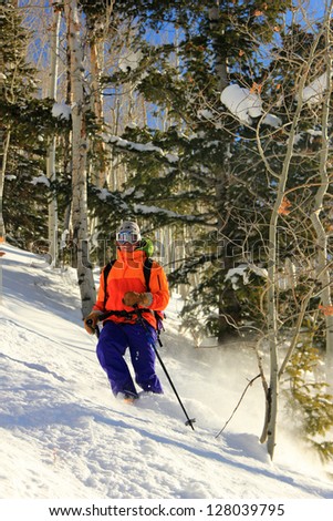Man skiing through a forest in the Utah mountains, USA.