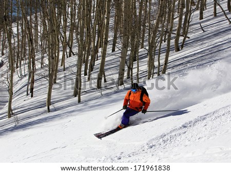 A rugged man skiing in the Utah mountains, USA.