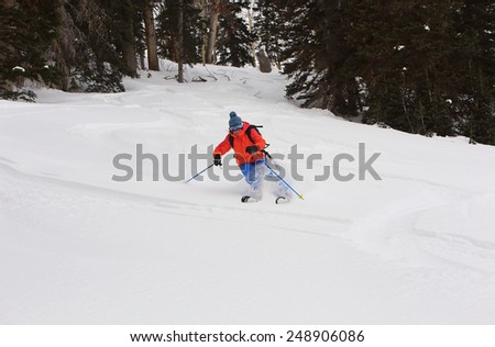 A woman skiing in the Utah mountains, USA.