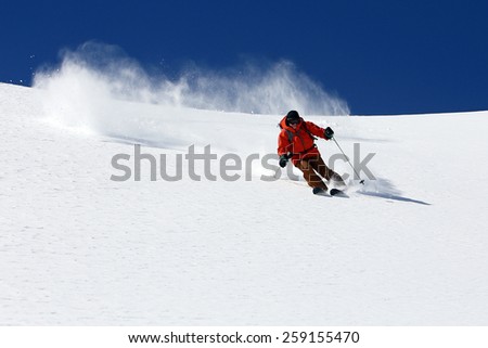 Skier on a sunny winter day, Utah, USA.