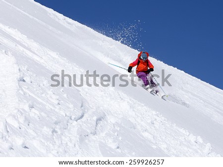 A woman skiing on a sunny winter day, Utah, USA.