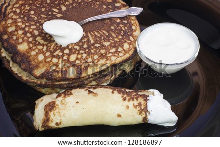  - stock-photo-pancakes-with-sour-cream-128186897