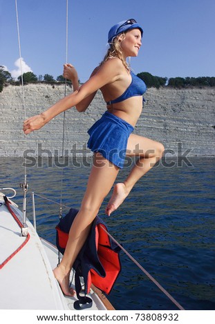 Young woman on a yacht off the coast. Black Sea.