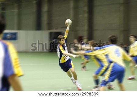 Young handball player in a match