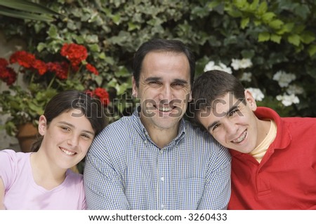 Father with teenager son and daughter