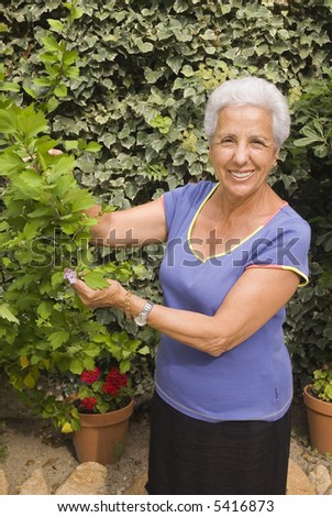 senior lady looking after her plants