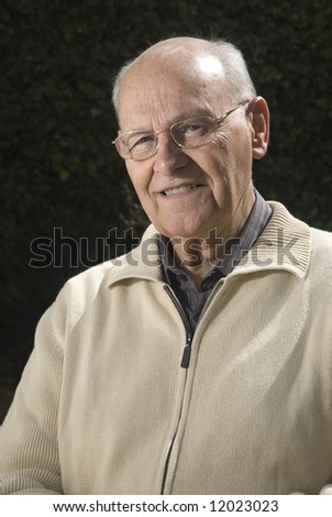 Portrait of a senior man standing in his garden