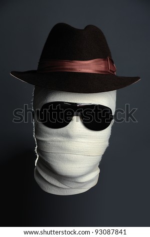 Portrait of The Invisible man in hat with black glasses on