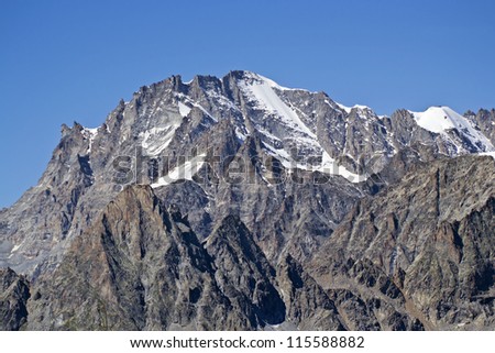 The north face of Gran Paradiso (4061 mt) photographed by Monte Colombo, Piedmont. In foreground Becco della Tribolazione, Vallone di Piantonetto. Gran Paradiso National Park, Italy