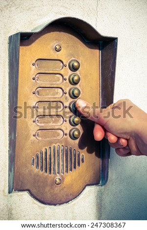 Finger ringing a door bell
