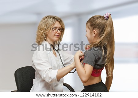 The doctor treats a child