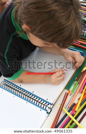Children student in your home, with crayons.