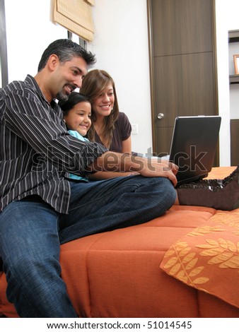 Family to meet in the room look at computer