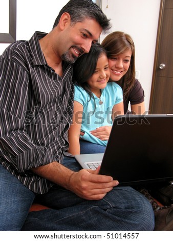 Family to meet in the room look at computer