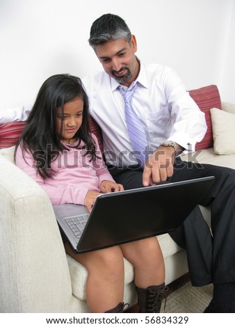 Parents whit son look in notebook on white background