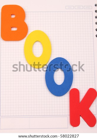 Plastic letters that spell out the words book.