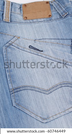 Aged blank leather patch on the back of a pair of jeans.