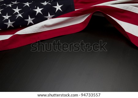 US Flag on dark wooden surface