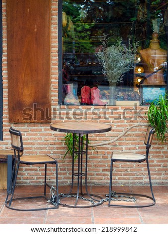 Cafe chairs against brick wall, vintage cafeteria