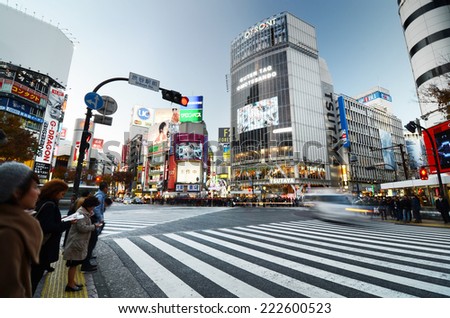 Tokyo, Japan - November 28, 2013: Crowds of people crossing the center of Shibuya district on November 28 2013, Shibuya is the most important commercial center in Tokyo, Japan