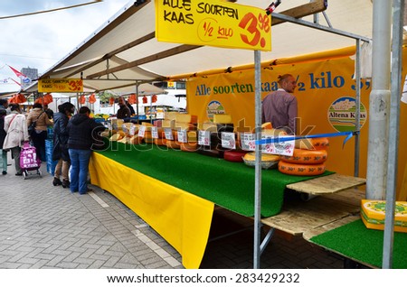 Rotterdam, Netherlands - May 9, 2015: Unidentified sellers and shoppers at the Street Market in Rotterdam. A large market is held in Binnenrotte, the biggest market square in the Netherlands.