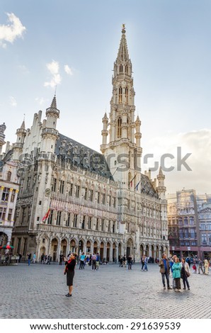 Brussels, Belgium - May 13, 2015: Many tourists visiting famous Grand Place (Grote Markt) the central square of Brussels. The square is the most memorable landmark in Brussels.
