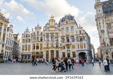 Brussels, Belgium - May 13, 2015: Many tourists visiting famous Grand Place (Grote Markt) the central square of Brussels. The square is the most important tourist destination in Brussels.