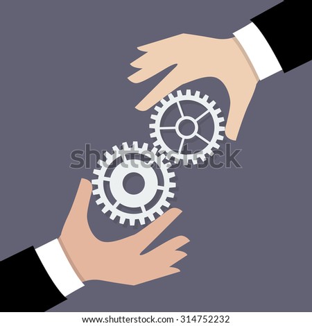 Two businessman hands with gears. Business teamwork concept