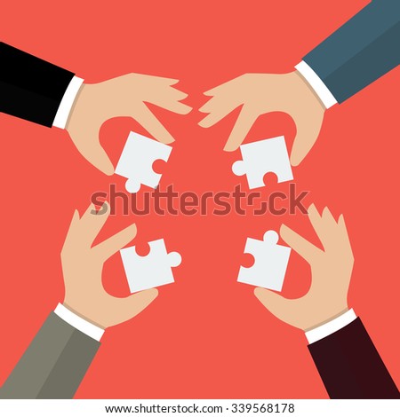 Businessmen insert jigsaw pieces together. business teamwork concept