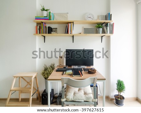 Home office working space. wooden shelf with white wall