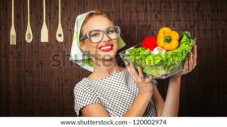 Rural woman cook holding bowl with vegetable, close-up